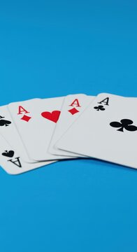 Playing cards fanned out on blue background
