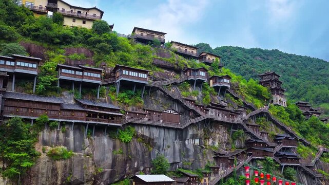 Beautiful ancient villages and traditional wooden buildings are built on the cliffs. The famous Wangxiang Valley Scenic Area is located in Jiangxi, China.