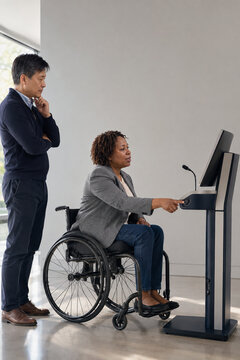Wheelchair user testing an accessible self-service workstation