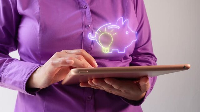 Close-up of person using tablet with animated money symbols