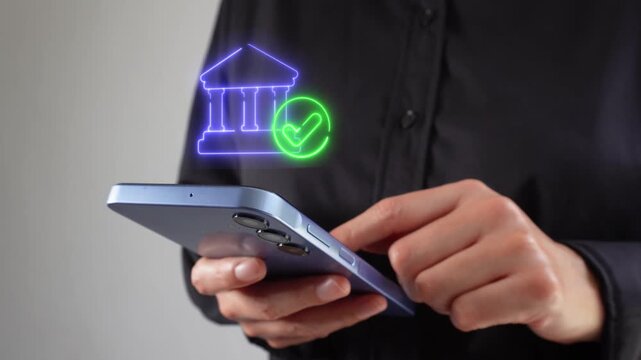 Secure financial institution. Businesswoman holding a smartphone with a virtual bank icon featuring a checkmark.