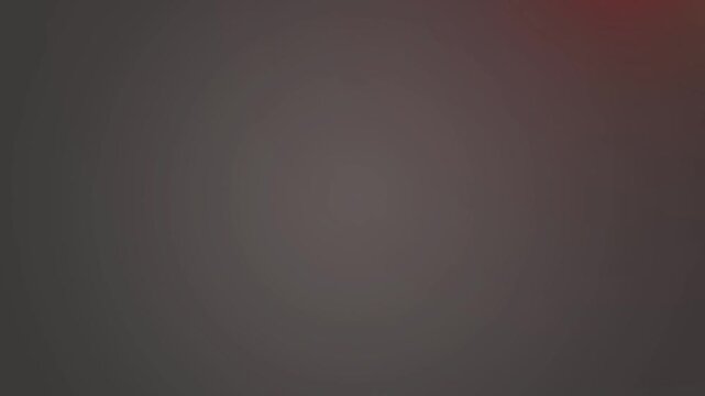 Abstract dark gray gradient background features a subtle warm reddish lens flare and soft vignette.