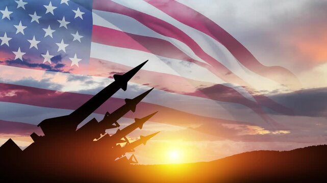 The missiles are aimed at the sky at sunset with USA flag. Bomb, chemical weapons, missile defense, a system of salvo fire.