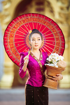 Gentle grace, vibrant culture. Authentic Lao tradition coming alive in a heartwarming morning smile. Elevate your next project with true Asian charm.