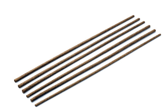 Set of five natural brown wooden sticks arranged diagonally isolated on transparent background