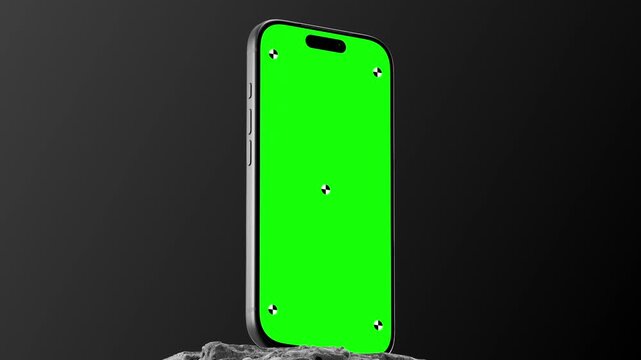 Smartphone Green Screen Mockup Standing On Stone With Black Background
