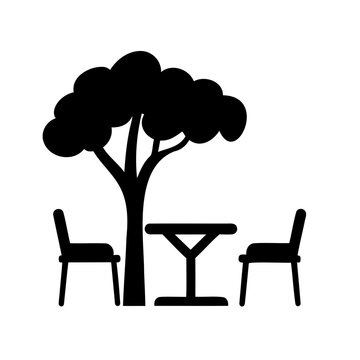 Minimalist picnic table under a tree with chairs - A clean, simple vector icon depicting a picnic setup with a tree, table, and two chairs for outdoor relaxation.