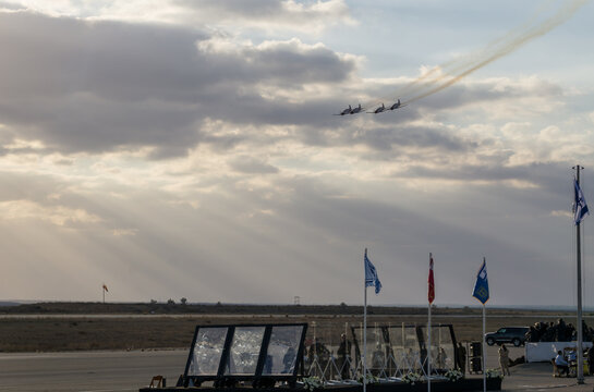A group of Israeli generals and politicians gather to watch the display of their latest war machines