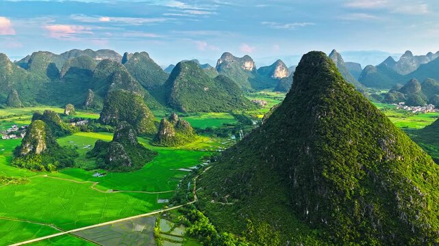 Aerial view of green karst mountain landscape and rice fields in Guilin, China