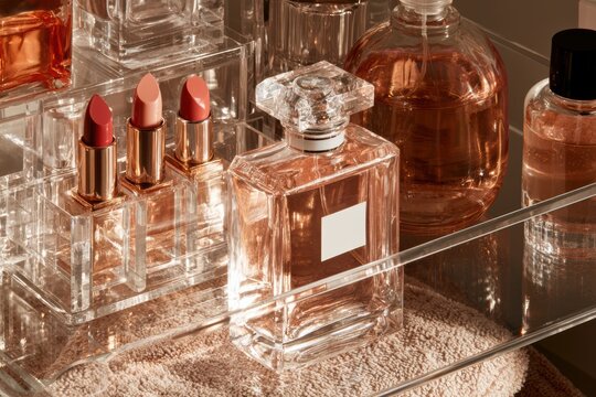 Cosmetic products for fragrance and makeup arranged on a vanity surface