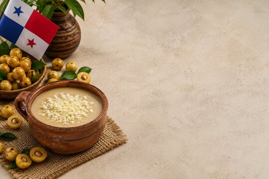 Traditional Panamanian nance dessert with white cheese in rustic clay bowl and copy space