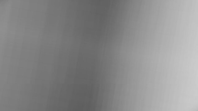 A smooth and minimalist abstract grey gradient background with soft texture