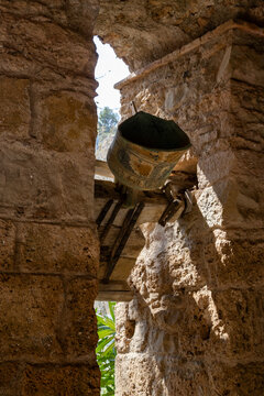 Old Bell at Sant Miquel del Fai Historic Monastery, Stone Architecture and Heritage in Catalonia, Spain