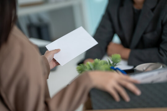 Stressful business women will resign from the company. Working female pass on document resign of manager. resignation, job placement and vacancies concept, career problem, problem life