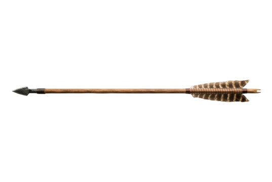 Traditional wooden arrow with stone arrowhead and natural feathers