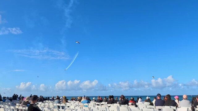 Stunt Plane Performing Aerobatics Over Crowded Beach in Surfers Paradise