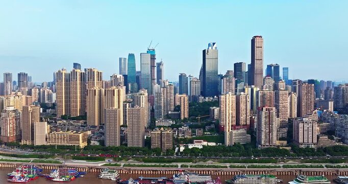 Aerial view of modern city skyline and riverfront with skyscrapers in Chongqing, China