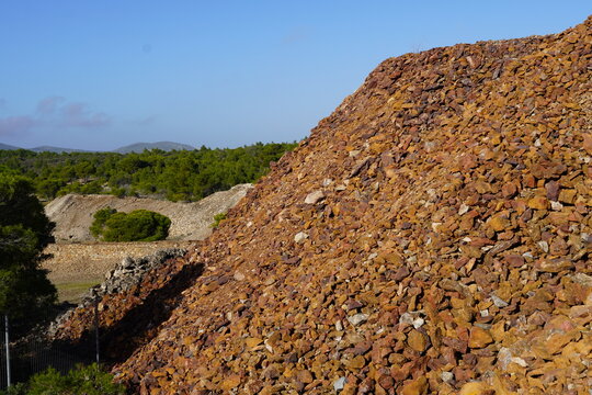 A heap of extracted mining ore, in the ancient Greek silver mine, workshop facilities, at Lavrio, Attica, Greece