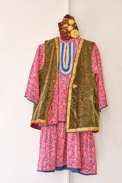Traditional female Tatar national costume with dress, velvet kamzol vest and embroidered kalfak
