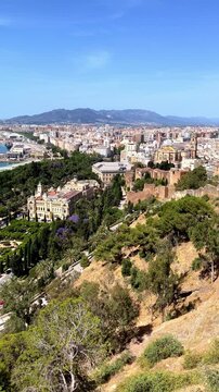 panoramic view of Malaga cityscape with Alcazaba fortress, Spain