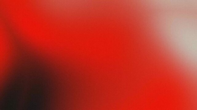 Deep red and dark gradient. Blurred motion with grainy texture. Dramatic backdrop for video projects.