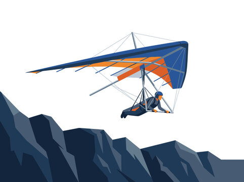 Person flying hang glider over mountains