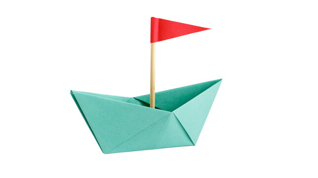 Teal origami paper boat with red flag on wooden stick, isolated on transparent background