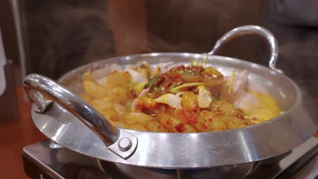 Steaming Korean Hot Pot on Grill, Seafood and Meat in Delicious Spicy Mix
