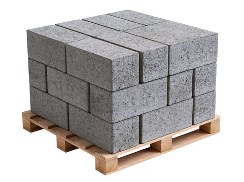 Stack of grey concrete blocks on a wooden pallet for construction and building projects