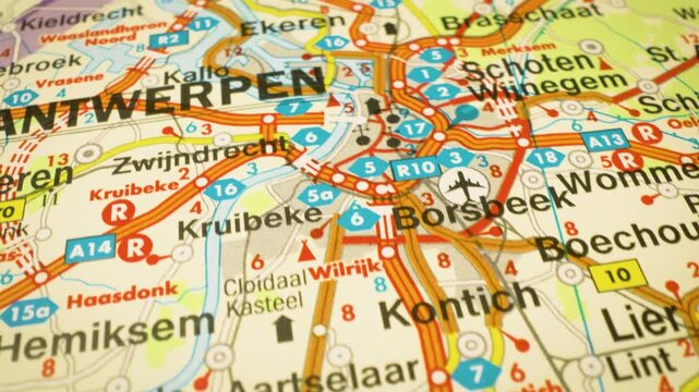 Road network leading to Antwerp, Belgium &ndash; gliding over atlas map