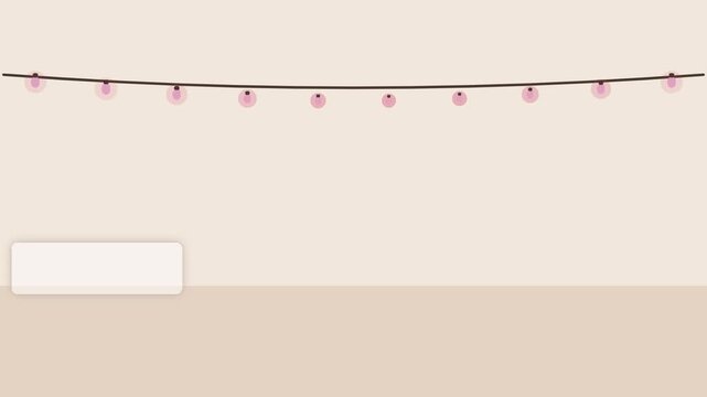String of pink light bulbs hanging against a plain beige background