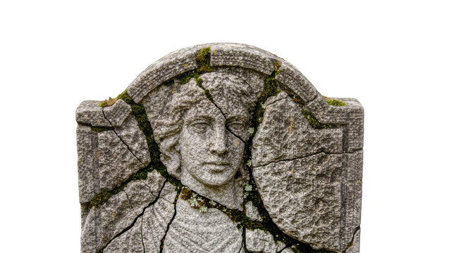 Cracked weathered stone tombstone with carved face and moss, isolated on transparent background