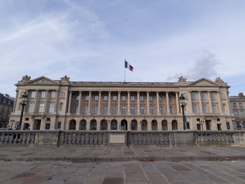 Hotel de la Marine facade on Place de la Concorde with a French flag flying