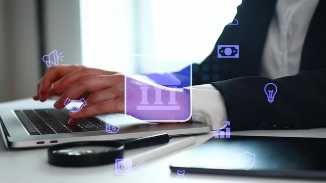 A person in a suit is typing on a laptop while sitting at a desk. Digital icons for finance and communication are visible around the laptop. The setting is likely an office.