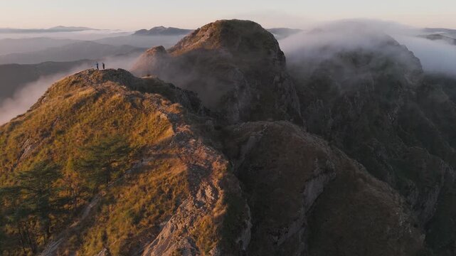 Drone view of Aiako Harriak three peaks while the sunrise, at the Basque Country.