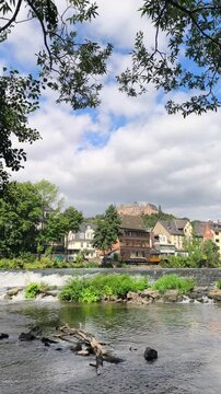 Scenic view of the historic city of Marburg, Germany, seen from the river. Urban architecture and the old town create a picturesque European cityscape.