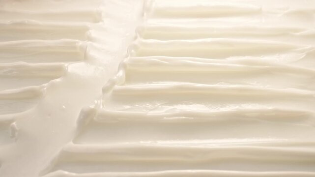 Silver Spatula Smearing White Skincare Face Cream Lotion Smooth Texture Macro Close Up Wavy Ridges Pattern Beauty Cosmetic Commercial Video