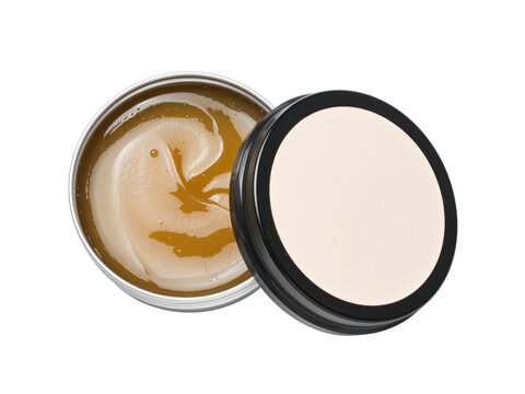 Open tin of amber grease beside a closed tin with a black lid, isolated on transparent background