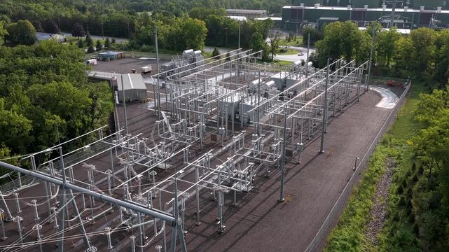 Electrical substation, power transformer, high-voltage busbars, circuit breakers, steel support structures for energy, power plant aerial rising in Dover Plains, New York