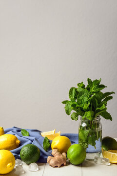 Ingredients for preparing lemonade on white tile table
