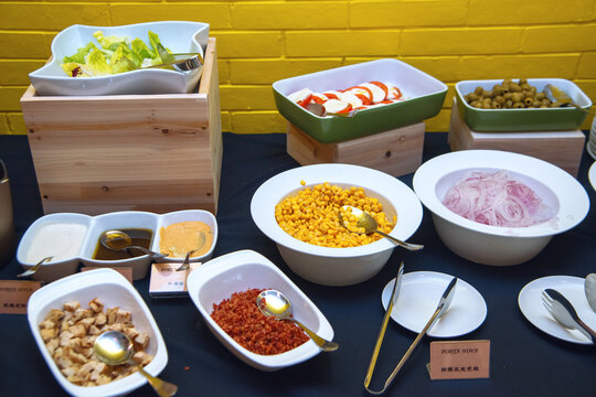 Fresh salad bar buffet with assorted toppings and dressings