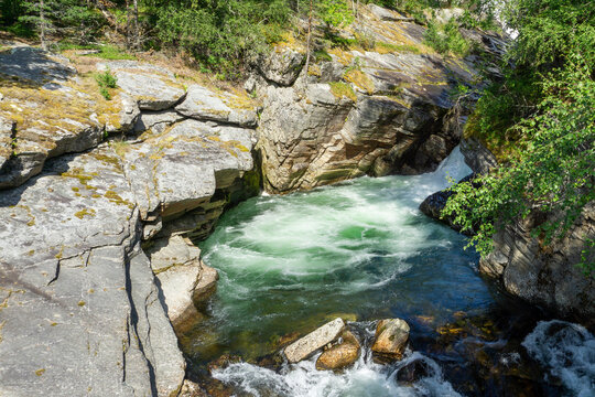 Staudamm and Ula river flowing through rocky canyon in Norway