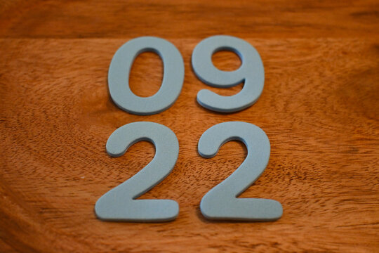 September 22 date numerals on a wooden surface