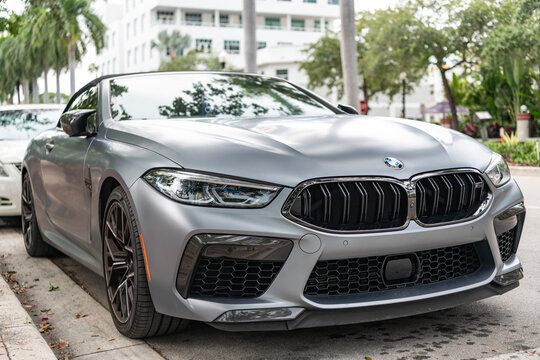 Miami, Florida, USA - May 05, 2025: BMW M8 Competition 2023 convertible car. Luxury convertible car BMW M8. Car BMW M8 convertible parked outdoor. Silver convertible car, low view