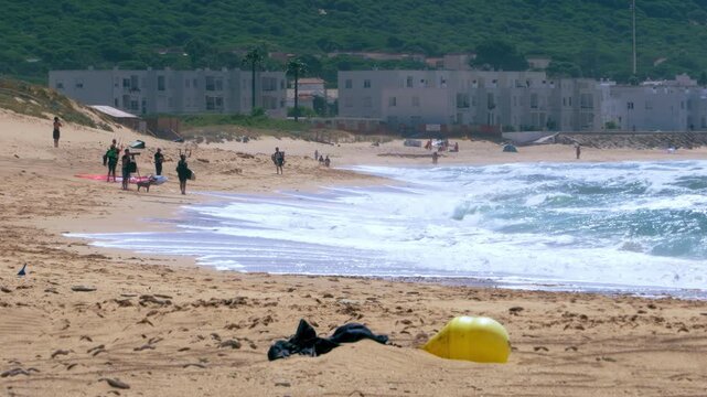 Trafalgar beach coastline with kite surfers on the background, Cadiz, Spain