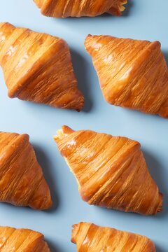 Croissant pattern on a blue background. Top view