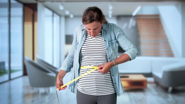 Woman Checks Her Belly