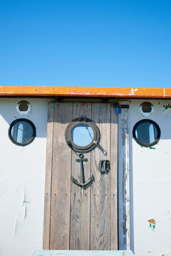 Close-up of the entrance door to a small fishing boat.