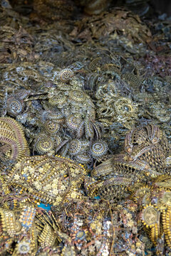 Pile of intricate handcrafted gold jewelry pieces made using the lost wax casting method, Dhaka Division, Dhamrai, Bangladesh