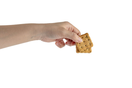 Peanut butter filled crackers, a snack in hand, on transparent background. 